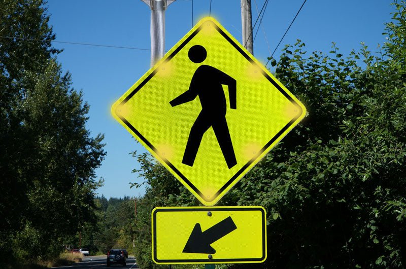 Blinking crosswalk sign with LED warning lights for pedestrian safety