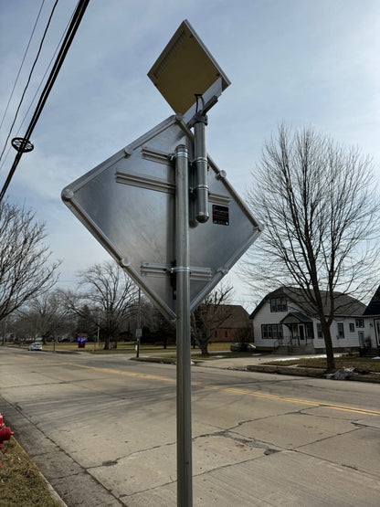 Solar-powered blinking crosswalk sign installed for pedestrian safety