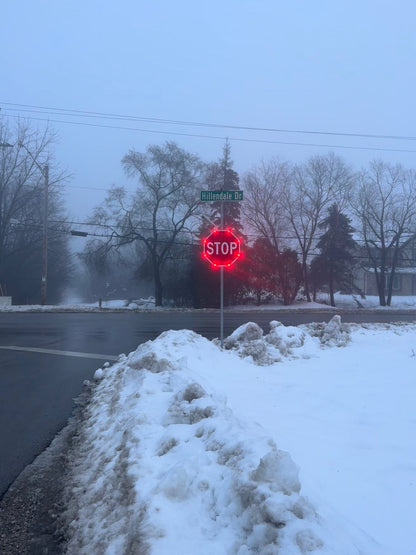 Flashing stop sign installed on a highway for improved driver awareness